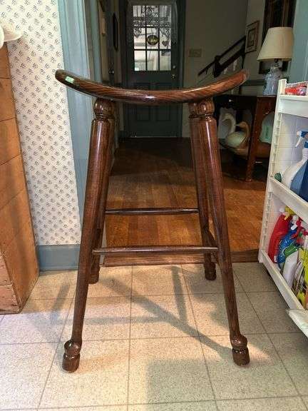 Solid hardwood saddle seat stool…..20-1/2 x 12-1/2 x 31 tall…..slight blemishes from normal use but solid piece image