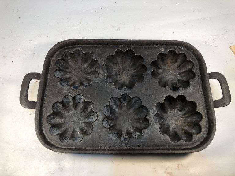 1800s gate marked cast iron Turk's Head muffin pan with six fluted cavities. Y mark. 12 x 7”. mark. 12 x 7”. image