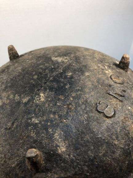 Antique gate marked 19th-century Louisiana cast iron sugar kettle. These large, spherical cast iron kettles were primarily used in the production of sugar on plantations in the American South, especially in Louisiana where sugarcane cultivation thrivedMarked 8 MG. 10” diameter. 8” H.