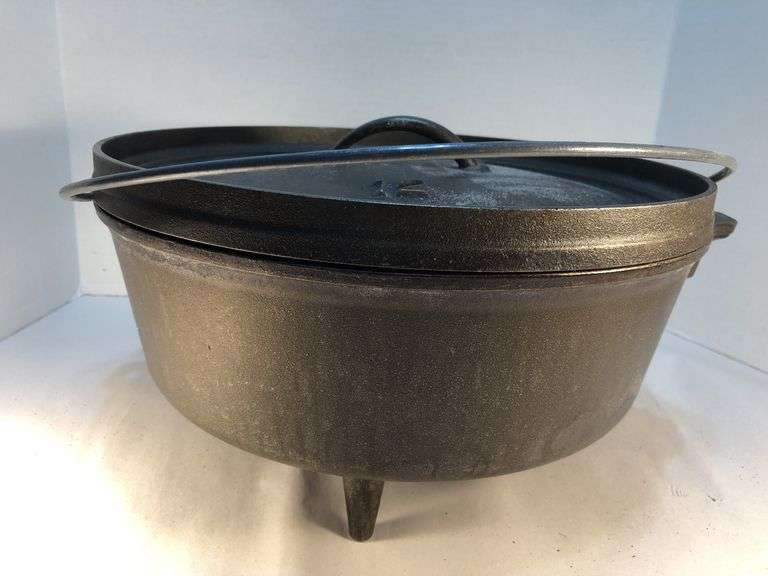 Lodge #12 12” 6 quart outdoor Dutch oven with flanged lid and integral legs. Stored in original box. Possibly new.