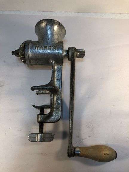 Antique Ward’s silver metal meat grinder. Wooden handle hand crank. Clamp for attaching to  surface for grinding meat. In excellent condition