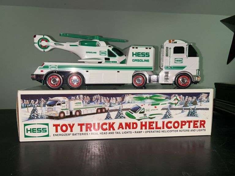 HESS Toy Truck and Helicopter in like new condition and in original box…..batteries are in box…..real head and tail lights, ramp, operating helicopter rotors and lights image