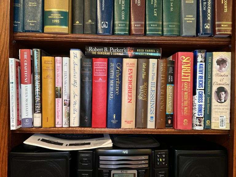 Shelf of books of various titles and by variety of authors…..both paperback and hardback image