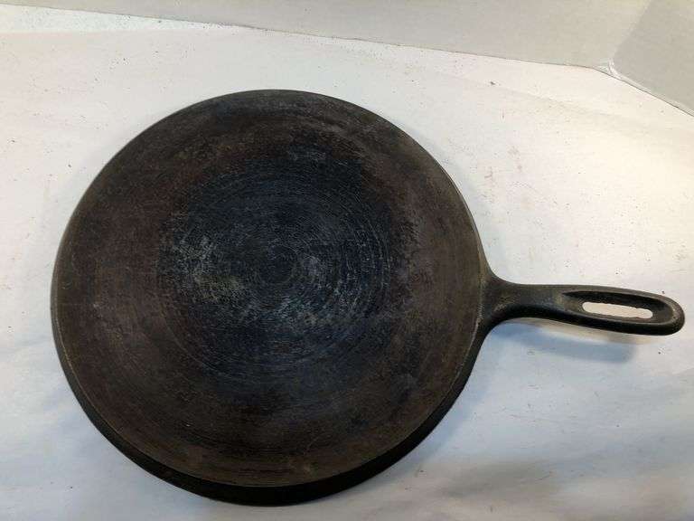 Wagner Ware cast iron griddle, specifically a No. 9 Sidney Arc Logo  Griddle. H G. 10.5” diameter. HS marked. No spin, no wobble.