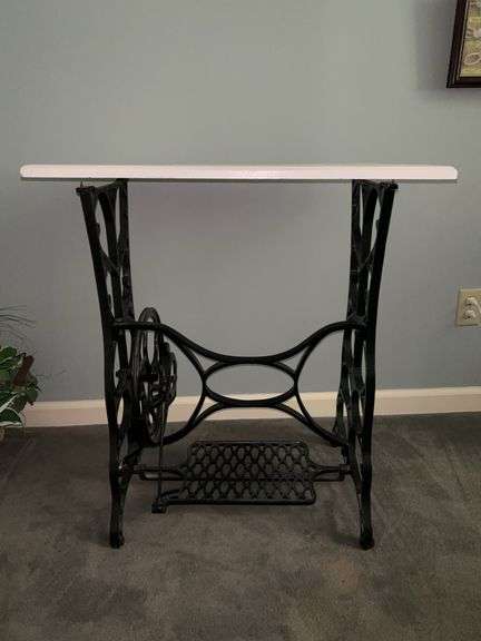 Antique sewing machine treadle with removable wood top image