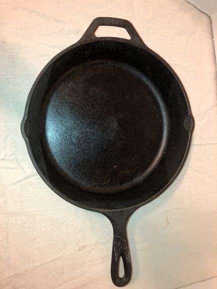Lodge #8 skillet,10.5 “ diameter. Seasoned. 2 small spouts. Assist handle image