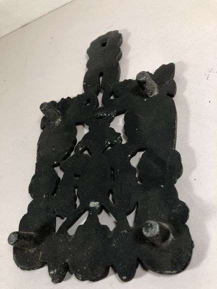 Vintage Wilton #9 grape and vine design scroll trivet, footed. Black finish. 7.25 x 4.25”.