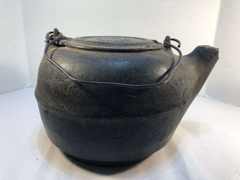 Antique gate marked #8 cast iron tea kettle. Starburst pattern. 11 1/2” x 9 1/2 “ 6.5” H. image