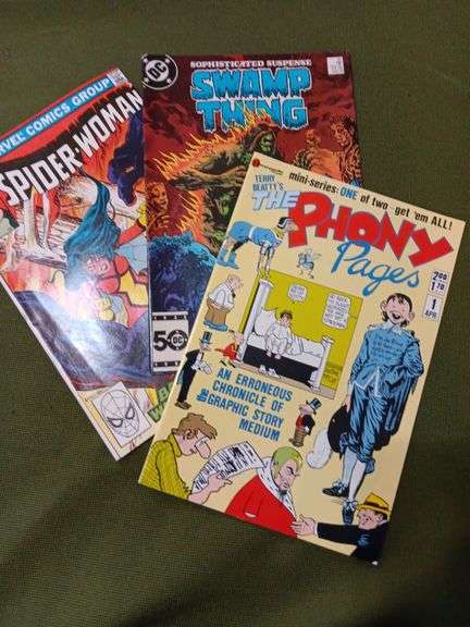 Set of 3 comics in good condition ,have been kept in sleeves . Spider Woman Number thirty four , the swamp thing number forty two and the phony pages april 1st image