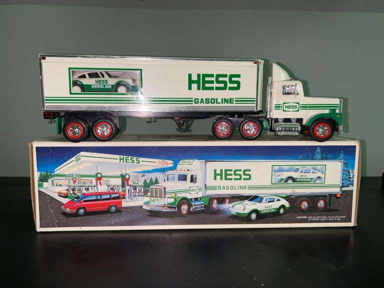 HESS Gasoline 18-Wheeler and Racer in like new condition with original box…..batteries not included…..real head and tail lights, racer with friction motor and lights image