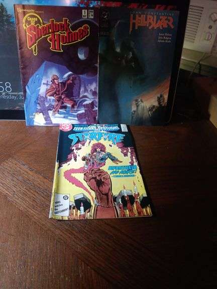 Set of 3 comics..great condition. Cases of Sherlock Holmes Number one,  Hell Blazer number 9 and Teen Titans spotlight on Starfire number 2..see description. image