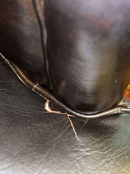 Barrel back leather office chair on casters…..sows wear from normal use but lots of life left…..sits and rolls very well….25 x 18 x 29-3/4 tall overall
