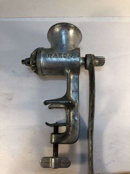 Antique Ward’s silver metal meat grinder. Wooden handle hand crank. Clamp for attaching to  surface for grinding meat. In excellent condition