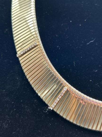 Gold tone choker with rows of clear stones…..clasp needs adjusted and tightened
