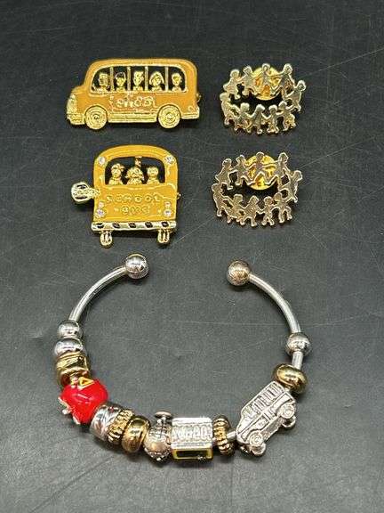It’s school time once again……nice selection of teacher pins and pandora-like cuff with teacher charms image