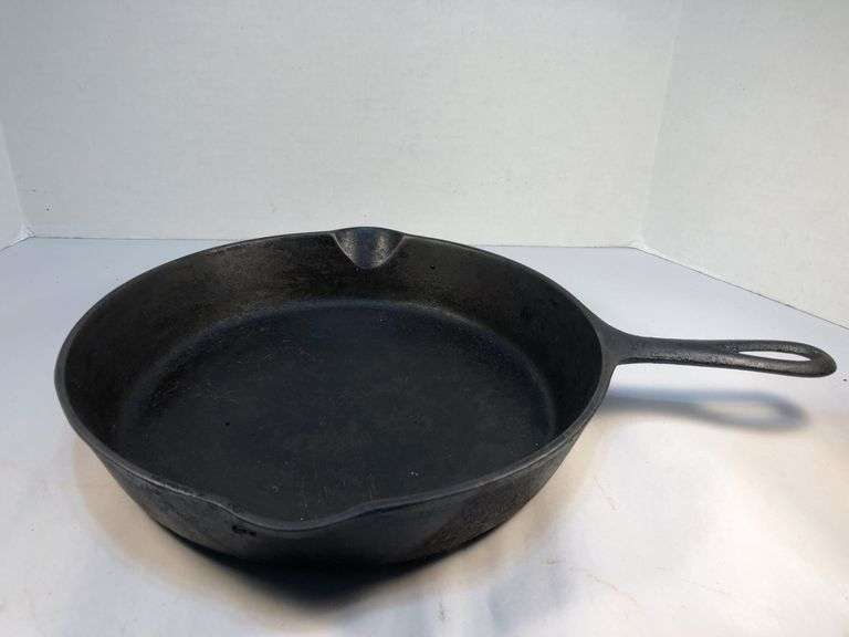 Antique #8 Lodge 3 notch skillet with heat ring. 10” diameter. 2 spout. No spin, no wobble. image