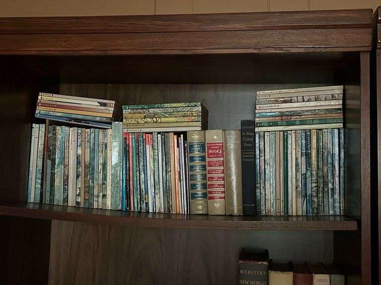 Shelf of vintage Readers Digest magazines and hardbacks of various titles image