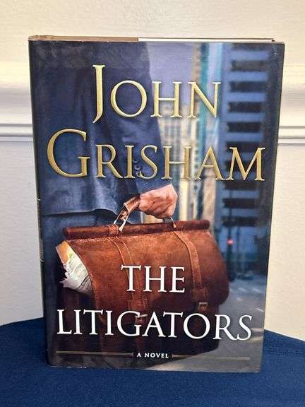 First Edition John Grisham “The Litigators” hardback with gloss finish dust jacket…..in like new condition image