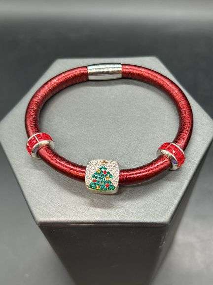 Elegant Brighton bangle with rhinestone Christmas tree charm and 2 red stone separators…..has magnetic closure and bag image