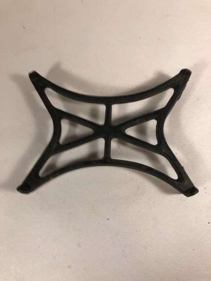 Antique cast iron black trivet. 5” x 3.5”