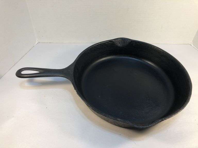 Unmarked #8  10” diameter 2 spout skillet. No spin, no wobble.