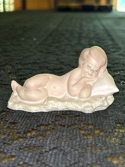 LLADRO Baby Jesus Sleeping on a Bed of Hay Bisque Porcelain Figurine (#4670)…..3-3/4” long x 2” tall…..part of the Children’s Nativity Series image