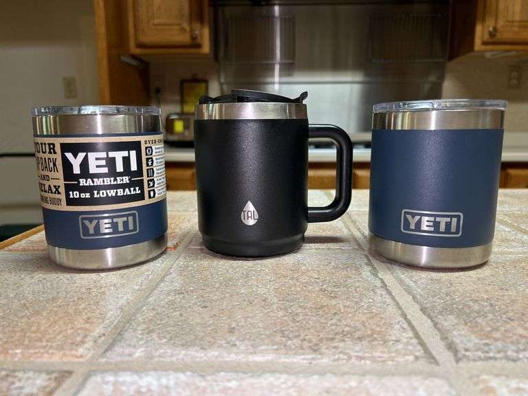 Selection of (2) Yeti 10 oz. lowball lidded cups (1 new, 1 used) and (1) TAL insulated lidded cup image