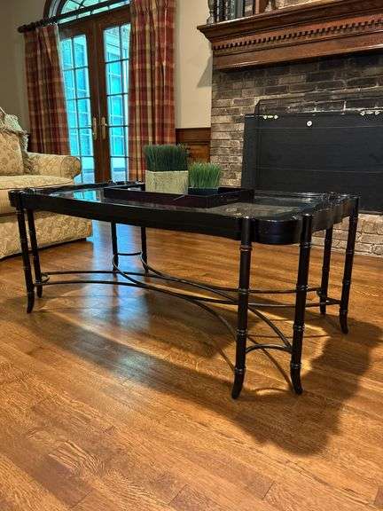 Black Wood Coffee Table with Glass Insert and bamboo-style legs…..CONTENTS ON TABLE ARE INCLUDED…..49 x 28 x 20-1/2 tall….does show wear from normal use image