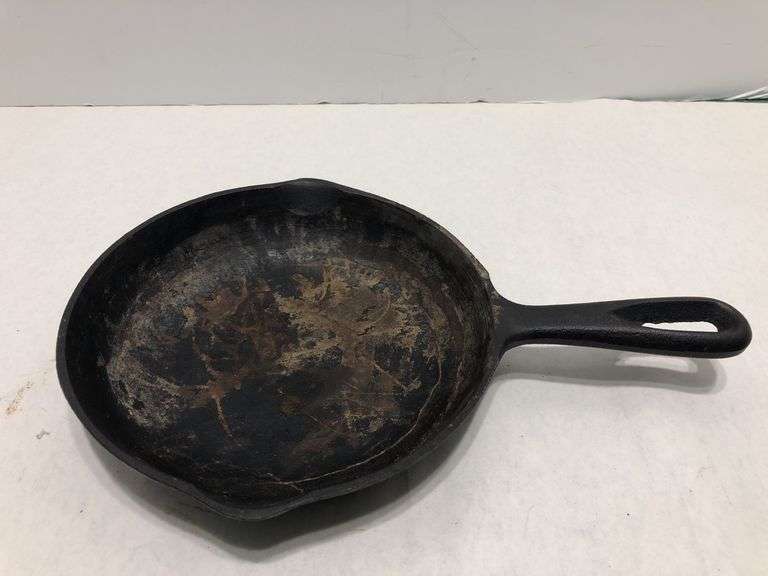 6 1/2” #2  3 notch skillet with heat ring and 2 spouts. Rounded interior surface. Made in Korea.