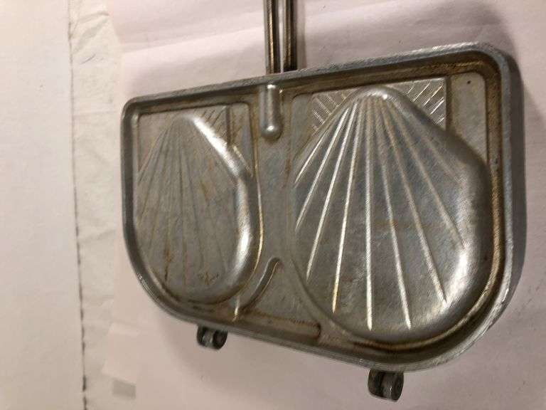 S.E. F.A.M.A. Aluminum French seashell sandwich/toast press. Made in France. Press 8 x 5” excluding handle.