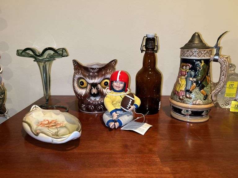 Nice selection of home decor items…..stein on right is musical, football boy is by Danbury Mint, owl pitcher was hand painted in Italy