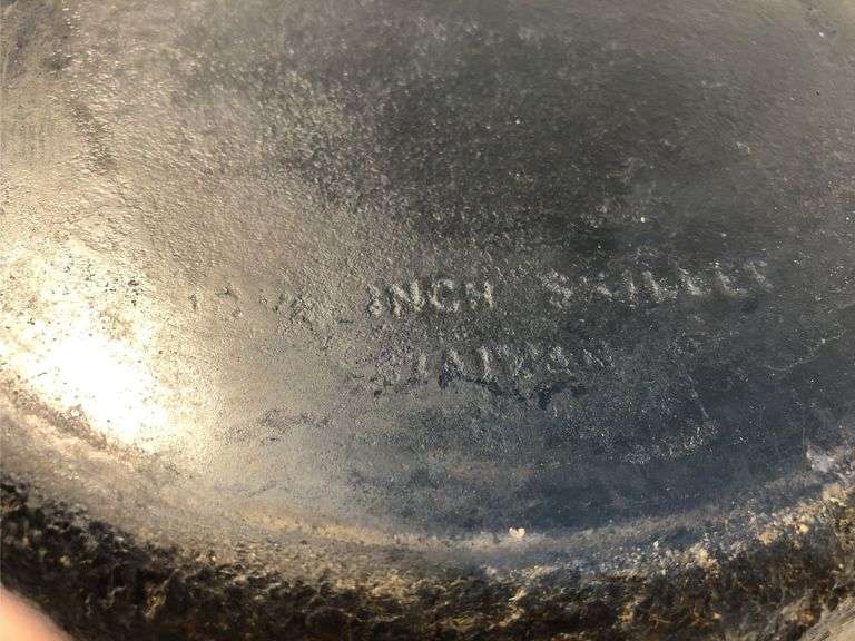 10” diameter 2 spout skillet with wooden handle. Made in Taiwan.