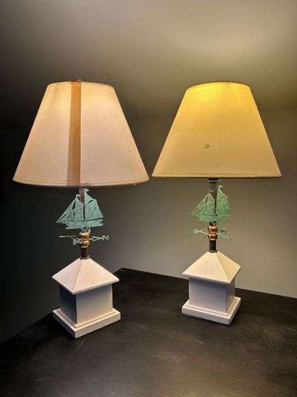 Pair of matching wood base lamps with metal weathervane decor…..16” tall image