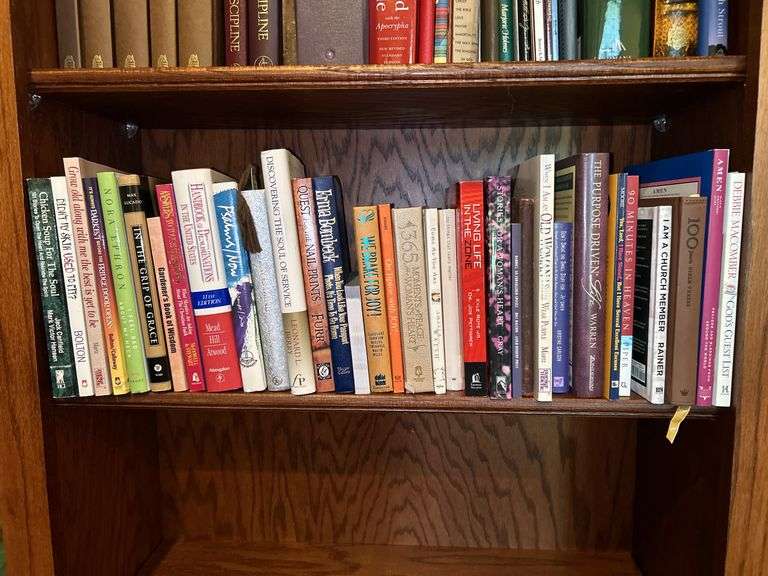 Shelf of books of various titles and by variety of authors…..both paperback and hardback image