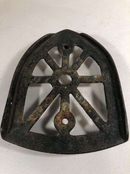 Antique cast iron trivet, specifically designed as a rest for a "sad iron" or "flat iron". 6 x 4.5”