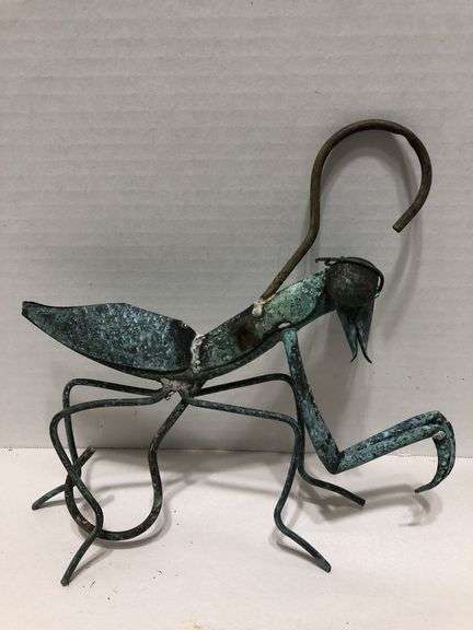 Metal garden grasshopper. Copper with green patina. 8” x 8” overall. Body 6” L image