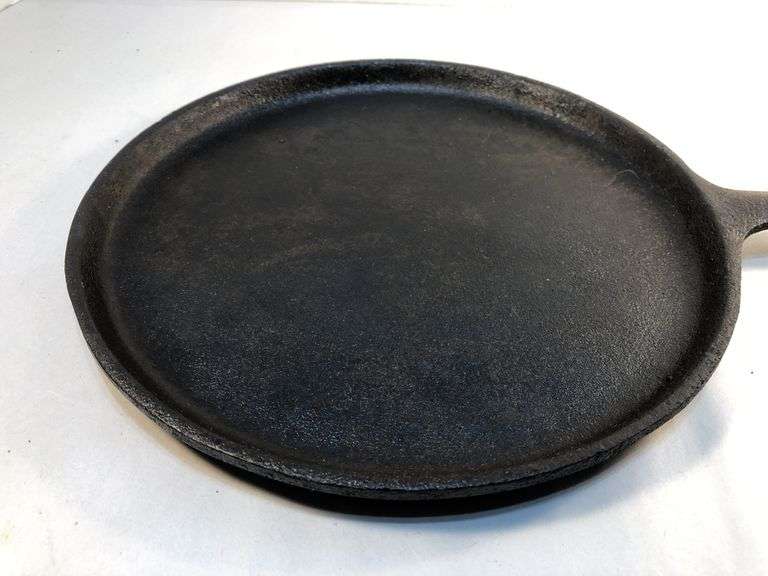 Lodge 9” old style griddle. USA  H 70G. Newly seasoned.