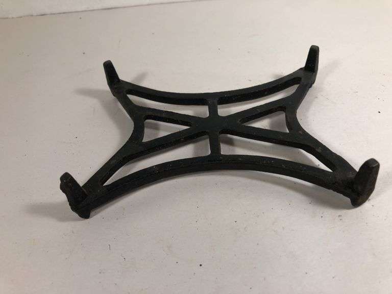 Antique cast iron black trivet. 5” x 3.5”