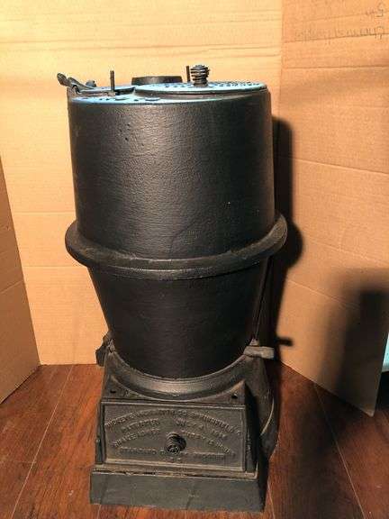 Antique cast iron #19 Buckeye Incubator Co. cast iron coal stove. 22” H x 11.5” W.
