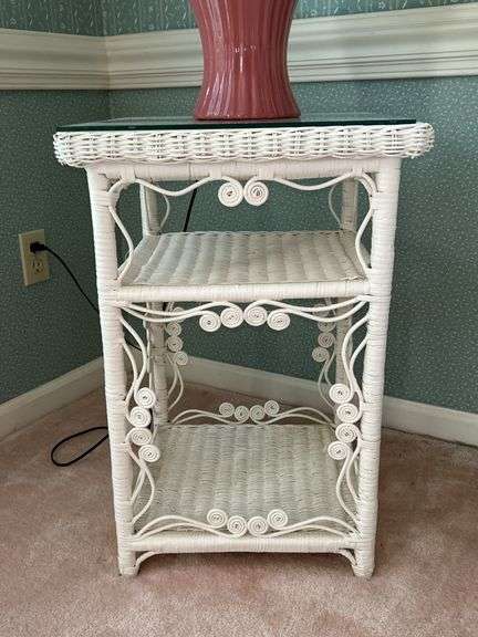 White wicker side table with scroll work design, middle/lower shelves and glass top overlay…..17-1/4” square x 25-1/2 tall image