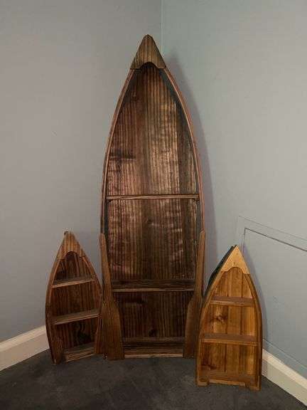 Collection of boat shaped shelving in various sizes image