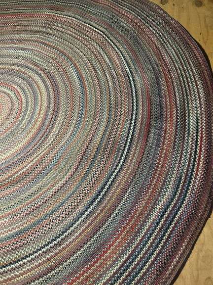 13-1/2’ x 9-1/4’ oval braided rug in really good condition…..there is a taped spot on back but didn’t find any loose braiding