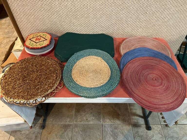 Grouping of a variety of placemats made from various materials and hot pads image