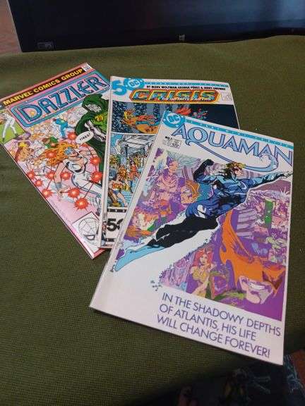 Set up 3 comics.Good condition have been kept in sleeves...Crisis number eleven , Dazzler number three and Aquaman  number one image
