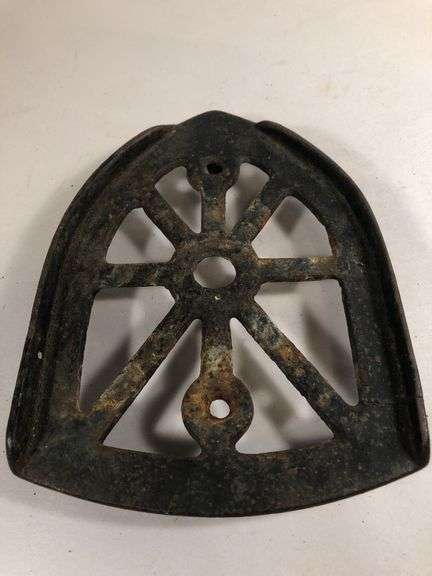 Antique cast iron trivet, specifically designed as a rest for a "sad iron" or "flat iron". 6 x 4.5”