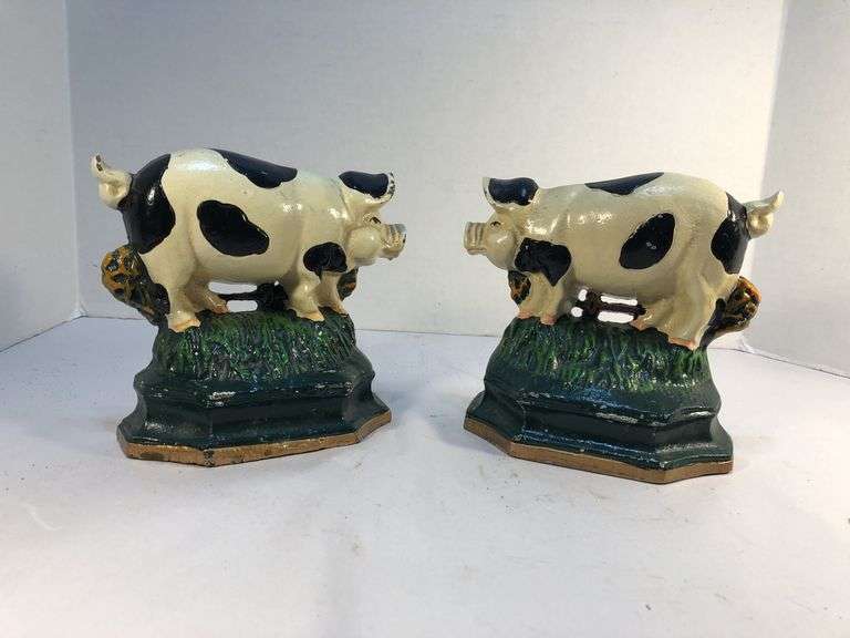 Vintage pair of cast iron black and white spotted pig book ends/door stops. 5 1/2” W x 5” H x 2”D. image
