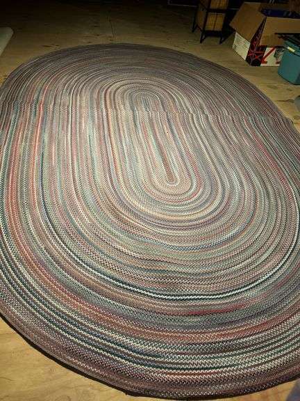 13-1/2’ x 9-1/4’ oval braided rug in really good condition…..there is a taped spot on back but didn’t find any loose braiding