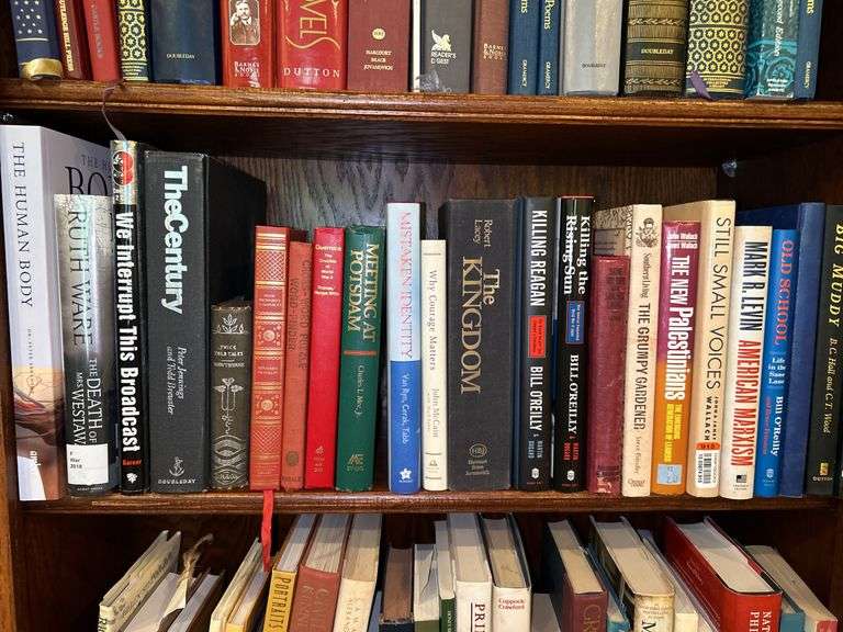Shelf of books of various titles and by variety of authors…..both paperback and hardback image