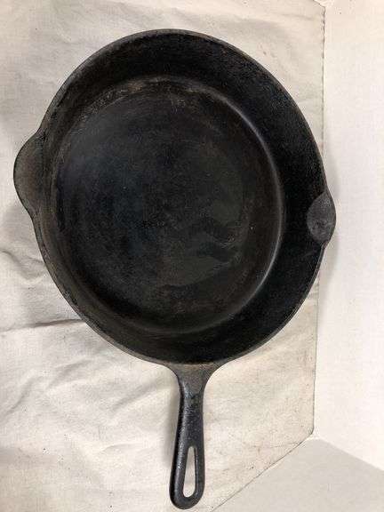 Griswold small logo, smooth bottom, 2 spout seasoned skillet. 11” diameter. image
