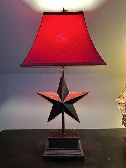 Nice looking resin base lamp with star center and red rectangular shade…..26-2/2” tall image
